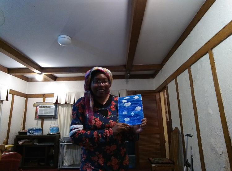 Picture of me holding cloud painting